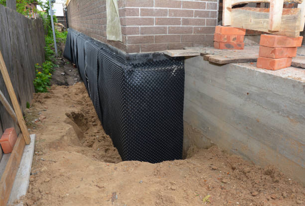 Happy homeowners after waterproofing job in Kent City